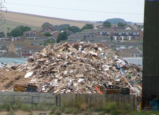 Stockpiled waste at the site in North Quay Road, Newhaven.